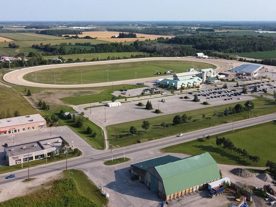 Aerial view of Grand River Raceway and Elements Casino Grand River near Elora, with the oval track and farmland around it