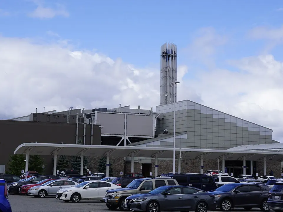 Elements Casino Brantford by day: the white entrance canopy and the tower beyond a full parking lot